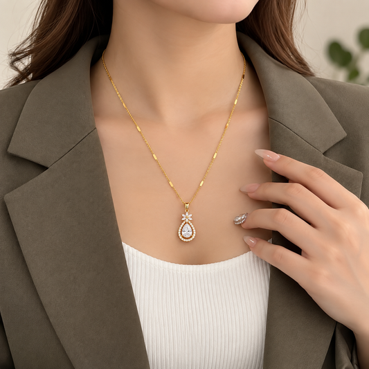 ANOVRA gold-tone teardrop crystal pendant necklace for women with floral detailing