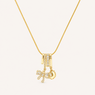 Gold-tone bow and sun charm necklace
