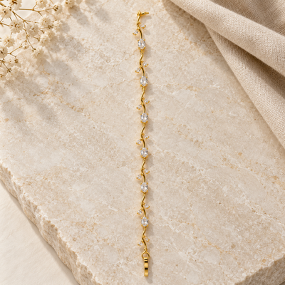 Gold-tone crystal vine bracelet with elegant styling