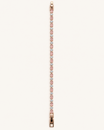 Rose gold tone blush pink bracelet featuring alternating oval pink stones and sparkling clear round stones on a light background.