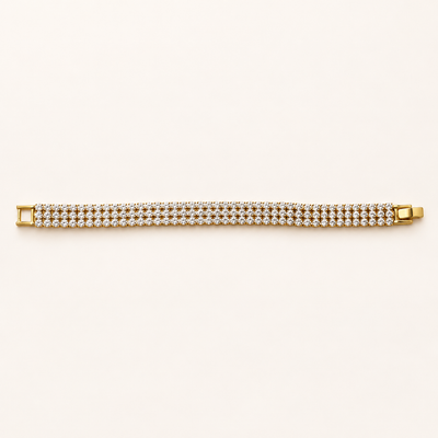Golden Radiance gold tone multi-row stone bracelet displayed flat on a cream background