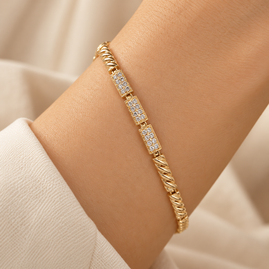 Close-up of gold crystal link bracelet on wrist