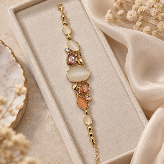 ANOVRA Pastel Aura Bracelet elegantly styled with minimal props, featuring pastel oval stones, polished gold tone beads and adjustable chain closure.