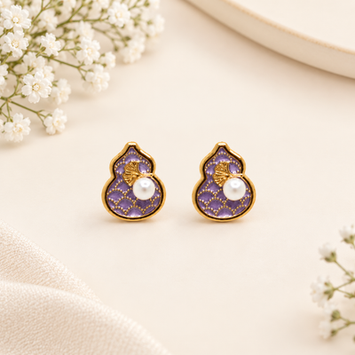 Gold-plated purple enamel earrings with white pearl embellishment