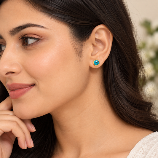 Gold-tone turquoise stud earrings with black marble pattern