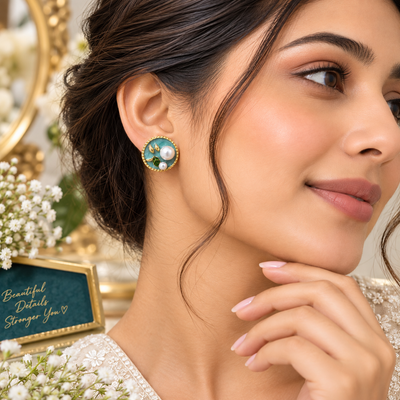 Turquoise round stud earrings with pearl-style accents and green leaf design