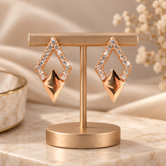ANOVRA rose gold geometric stud earrings styled with minimal luxury props.