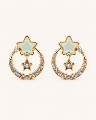ANOVRA gold-tone celestial star earrings with mint-green stars and sparkling crystal hoops.