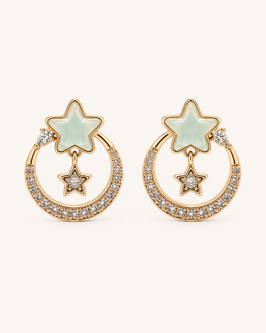 ANOVRA gold-tone celestial star earrings with mint-green stars and sparkling crystal hoops.