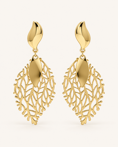 ANOVRA gold leaf drop earrings featuring intricate botanical openwork and polished golden detailing.