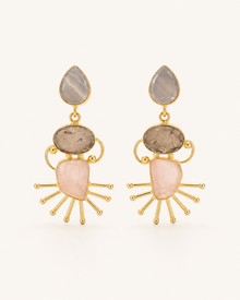 ANOVRA Celestial Stone Drops featuring blush-pink, smoky-grey and earthy-toned stones with gold sunburst detailing.