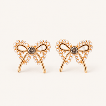 Pearl bow stud earrings with gold-tone finish