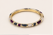 Anovra multicolor enamel gold-tone bangle bracelet on #F9F5F0 background
