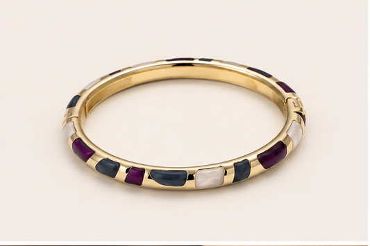 Anovra multicolor enamel gold-tone bangle bracelet on #F9F5F0 background